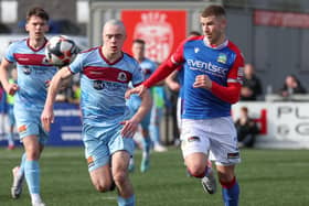 Linfield's Ethan Magee  and Institute's Oisin Devlin