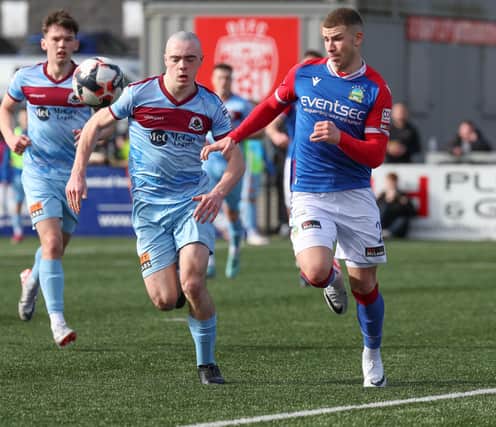 Linfield's Ethan Magee and Institute's Oisin Devlin