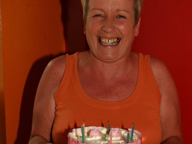 Jo Jo Gormley shows off her birthday cake at her surprise party in Becketts 7155dd : Parties and celebrations in Derry back in July 2005: Jo Jo Gormley.