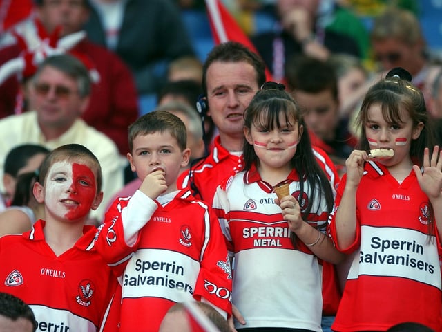 Kids getting tucked into their ice creams despite the intermitent showers at Croke park. (3108A26)