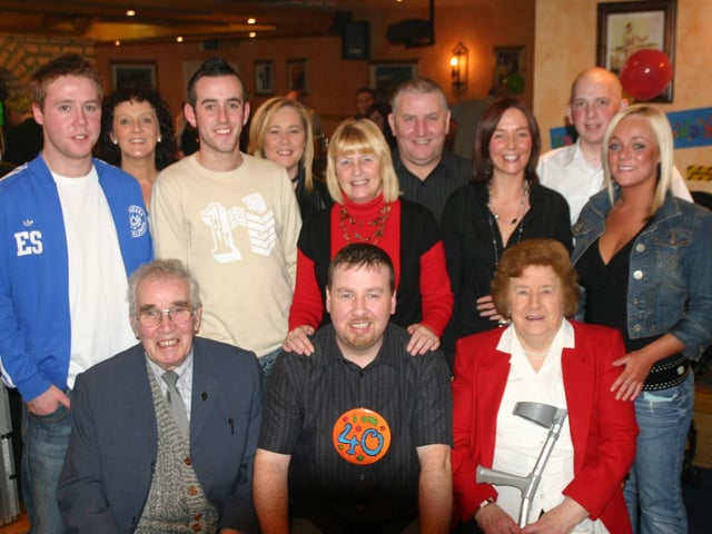 Raymond McKenna seated centre with the McKenna's having a good time at the 40th Birthday Party in the Don Bar. 1195/dd : Parties in December 2005.