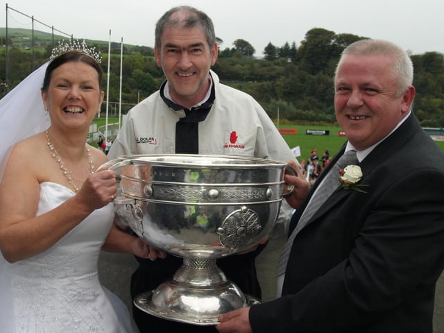 Stop the wedding.......... Newly weds Pauline and Hubert McCauley who left their guests to get their hands on Sam. :Celebrating Tyrone winning the All-Ireland Senior Football Championship against Armagh in September 2003