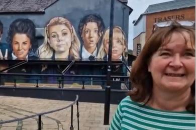 Helen Hamlett, who was visting Derry from Warrington with her family, has watched Derry Girls a few times and said: "This is my first time in Derry. We just landed about an hour ago and then we are going over to Donegal." Speaking about the awning she said the mural "was better before it was there, but it is still worth having a look at."