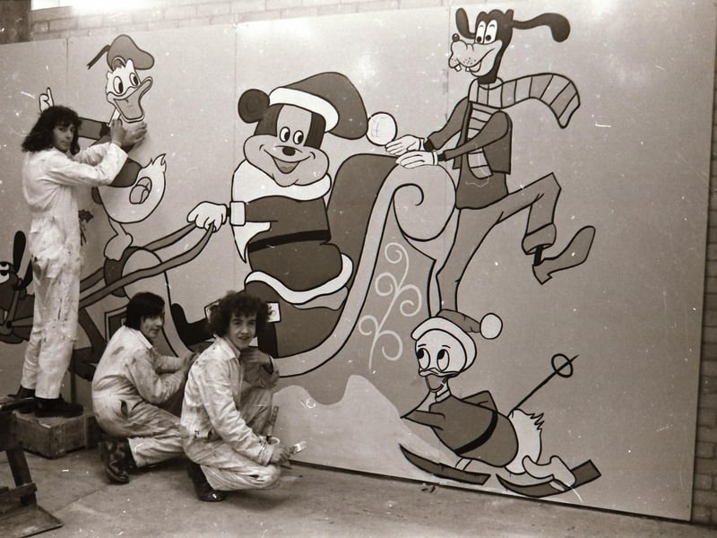 L-R : Painting apprentices Neville Friars, Patrick McCallion and Brian Tierney from the government training centre in Maydown working on one of 10 murals commissioned by Derry City Council to be put on display as part of the Christmas decorations around the city centre.