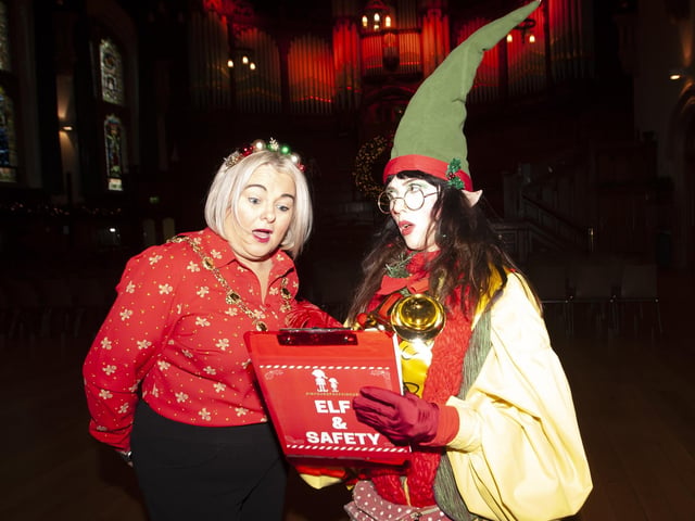 THE CHRISTMAS EXPERIENCE. . . .Mayor Sandra sees her itinerary for the Christmas Experience at the Guildhall on Saturday. :.