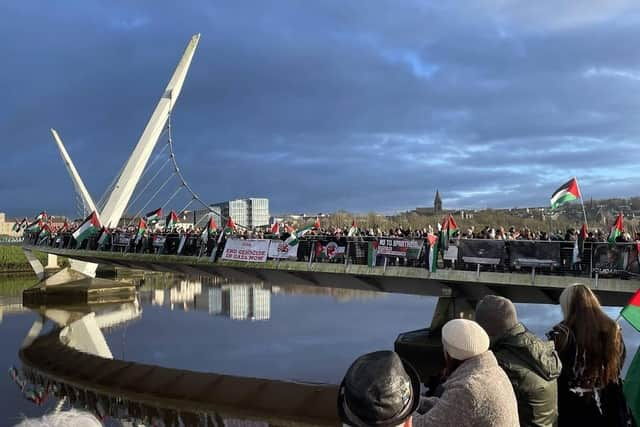 The Peace Bridge was draped with Palestinian banners and flags during the protest on New Year's Eve.