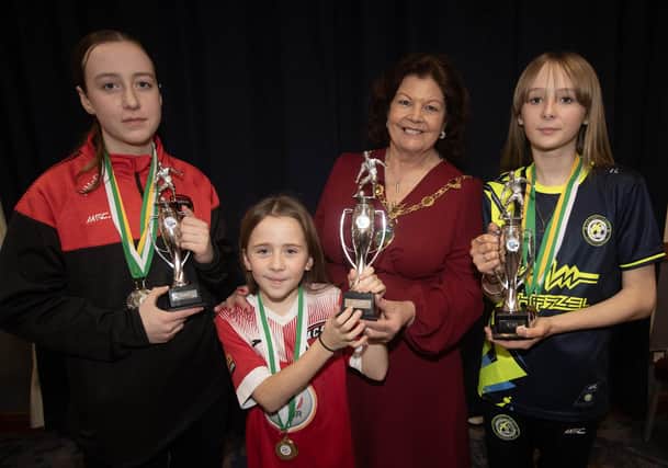 PLAYER OF THE YEAR. . . .The Mayor, Patricia Logue pictured presenting player of the year awards to, from left, Niamh McDaid, Phoenix Swifts (u-14); Lucy Blair, Maiden City Soccer (u-10) and Lara Logue, Sion Swifts (u-12) at Saturday night's awards in the City Hotel.