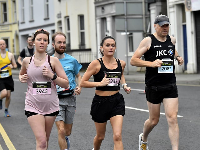 Second Wave runners in the Waterside Half Marathon make their way along Limavady Road. Photo: George Sweeney