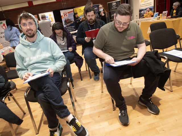 Some of those in attendance filling out health questionnaires on Tuesday night.