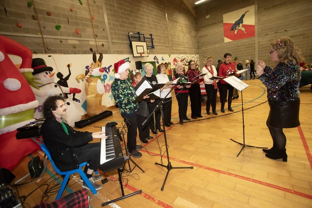 The Momentum Choir performing at Saturday's 'Christmas Get-Together'. : .