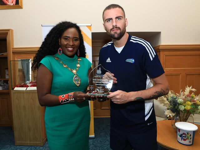 Mayor Lilian Barr making a presentation to the Street Soccer NI team captain, Ryan Sharkey, winners of the Irish Street Soccer League held in Dublin. (Photo - Tom Heaney, nwpresspics)