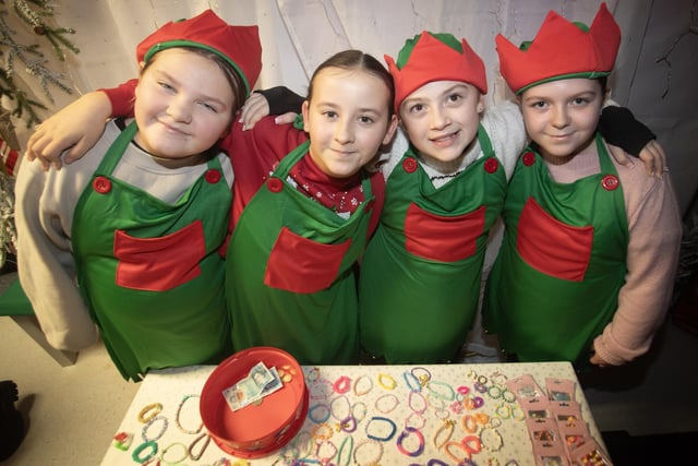 SANTA'S ELVES. . . . .Some of the P7 girls helping out during Thursday night's event in Holy Child PS.