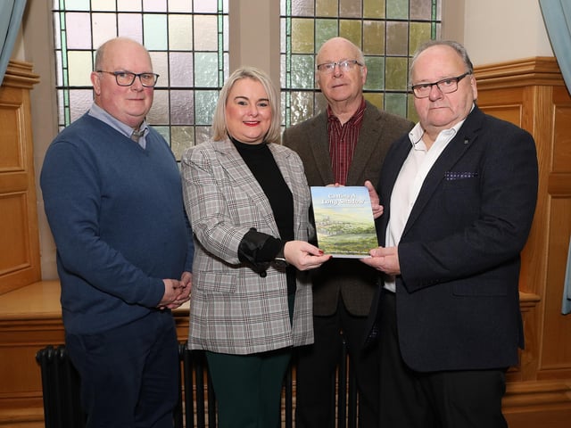 Mayor Sandra Duffy is presented with a copy of the book  "Casting A Long Shadow" (a people's history of Derry's Long Tower), from on right co-authors Ivor Doherty, Joseph Martin and on left Martin McGeehan when they visited the Mayor's Parlour. (Photo - Tom Heaney, nwpresspics)