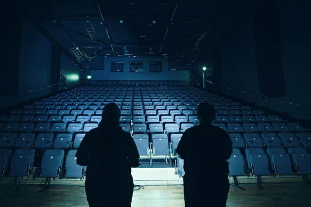 Kim and Jason on a paranormal investigation in an old theatre.