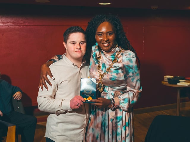 Dara Friel joins Derry City & Strabane District Council Mayor Lilian Seenoi-Barr for a photograph to remember the occasion. : .