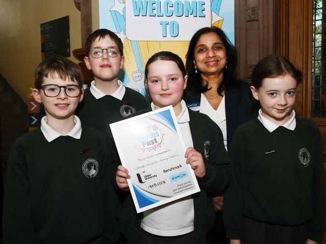 Sumeeta Gupta, event organiser, pictured with Omagh Integrated Primary School pupils at the Foyle Kumon NI Maths Fest in the Guildhall. : .
