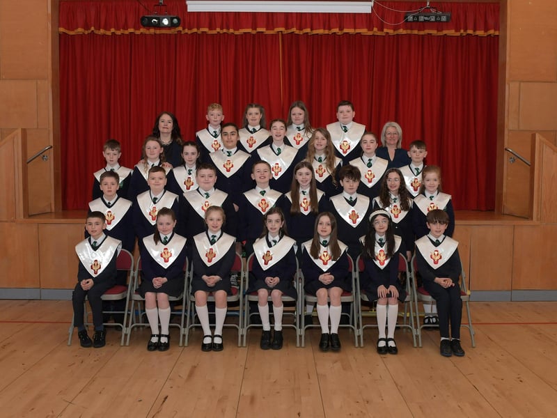 Pupils from St Patrick’s Primary School who recently made their Confirmation at St Patrick’s Church in Pennyburn. Included in the photograph are Mrs. S. Smith (teacher) and Mrs T. McCloone (classroom assistant). Photo: George Sweeney