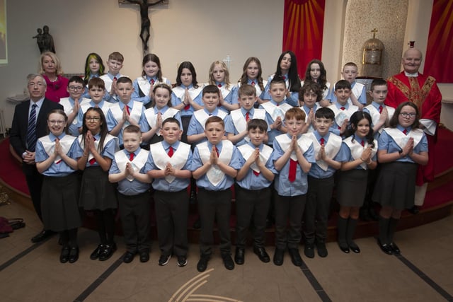 Pupils from Mr. Paul O’Doherty’s class at St. Brigid’s Primary School who received the Sacrament of Confirmation from Fr. John Farren at St. Brigid’s Church, Carnhill on Wednesday afternoon last. Included is Principal Ms. Mary McCallion. (Photo: Jim McCafferty Photography)