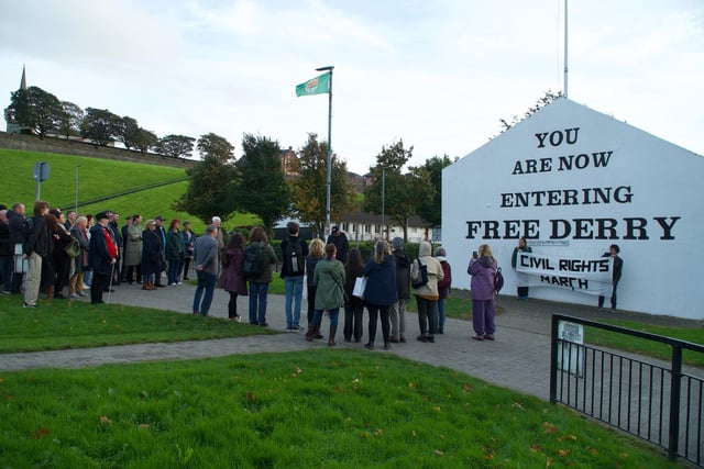 Crowds attend memorial at Free Derry Corner.