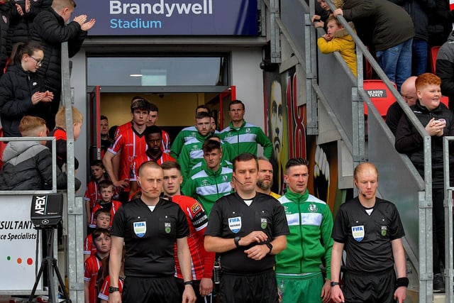 Match referee Robert Harvey leads out the Derry City and Shamrock Rovers teams for Monday evening’s big game at the Brandywell.  Photo: George Sweeney.  DER2318GS – 37