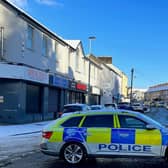 A police car blocks Spencer Road after a road accident on Thursday.