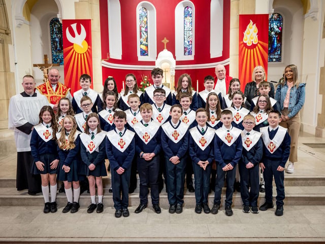 Pupils from Mrs Crumley's Class, St Patrick's Primary School, pictured at their confirmation at St Patrick's Chapel, Pennyburn. Included, are Fr Noel McDermott, Fr Michael McCaughey and Fr Sean O'Donnell. (Stephen Latimer)