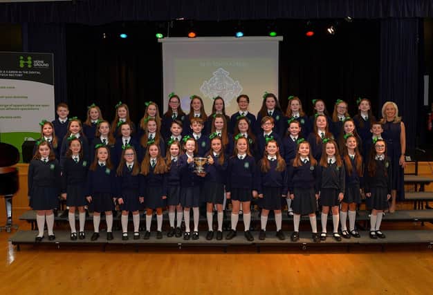 St Patrick’s Primary School choir, winners the Bishop Daly Cup at the Derry Feis Choir Competitions held in St Mary’s College on Tuesday. Included in the photograph is musical director Ursula Cullen. Photo: George Sweeney.  DER2314GS – 06