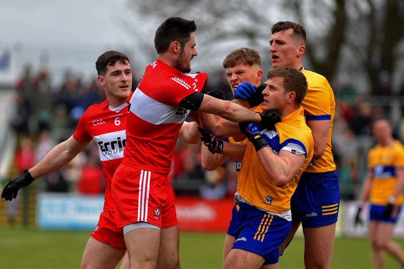 March 2023: Padraig McGrogan and Chrissy McKaigue scuffle with Clare players in Owenbeg as Derry's great start to 2023 continued. Photo: George Sweeney.