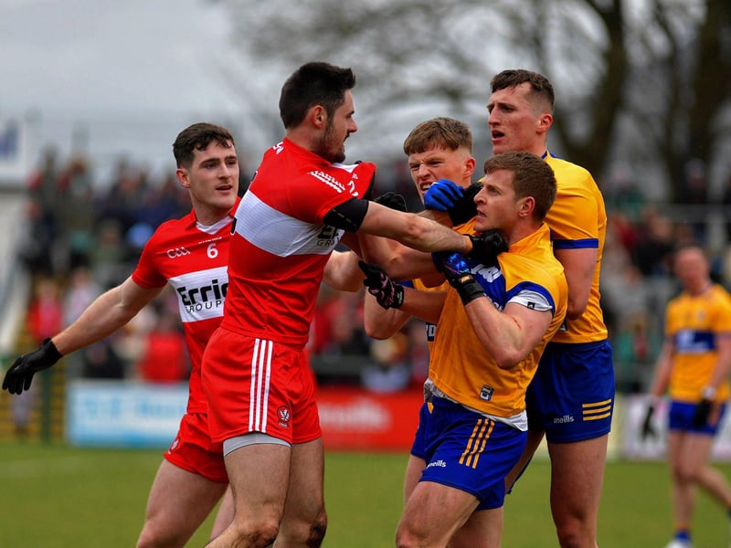 March 2023: Padraig McGrogan and Chrissy McKaigue scuffle with Clare players in Owenbeg as Derry's great start to 2023 continued. Photo: George Sweeney.