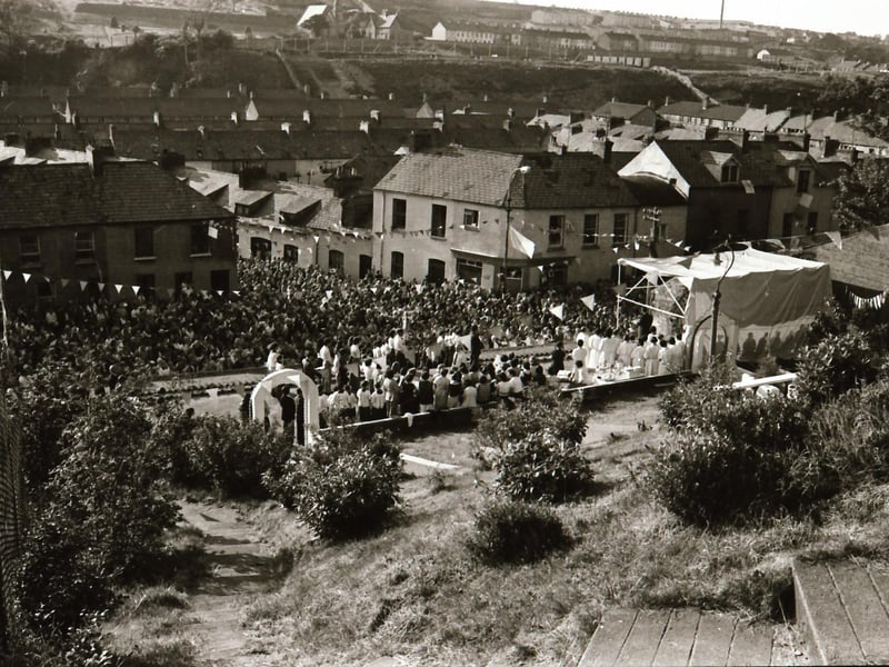 People gathered by the grotto in the Brandywell to celebrate St Columba's Day.