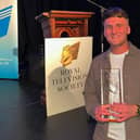 Nathan Edgar with his award