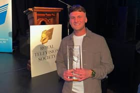 Nathan Edgar with his award