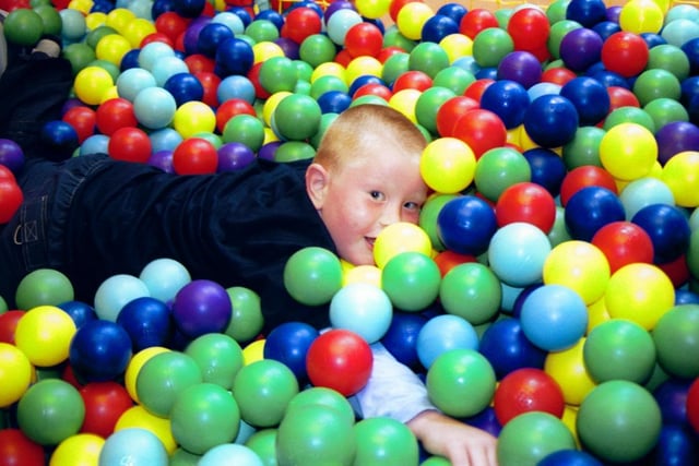 Timothy spots the photographer at the Fun Factory. 150503HG8