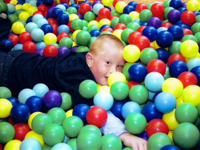 Timothy spots the photographer at the Fun Factory. 150503HG8