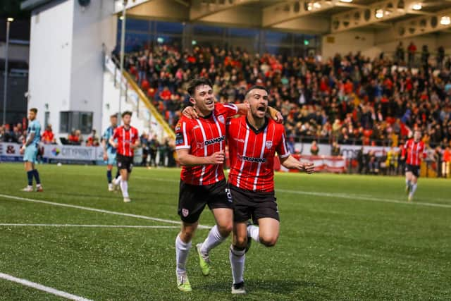 Adam O'Reilly celebrates with goalscorer Michael Duffy who put Derry City 3-0 up at Brandywell against his former club Dundalk. Photograph by Kevin Moore