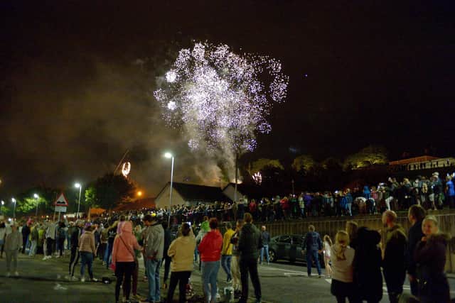 Spectators enjoy the fireworks display at the Gasyard Feilé’s Festival of Fire at Free Derry Wall on Thursday evening last. DER3319GS - 061