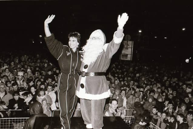 Santa, with help from TV Gladiator Falcon, also known as Bernadette Hunt, switched on the Derry Christmas lights.