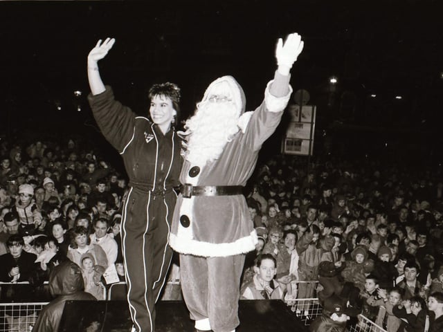 Santa, with help from TV Gladiator Falcon, also known as Bernadette Hunt, switched on the Derry Christmas lights.