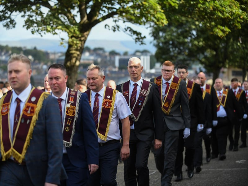Members of the Armadale Branch of the ABOD parade around Derry’s Walls. Photo: George Sweeney