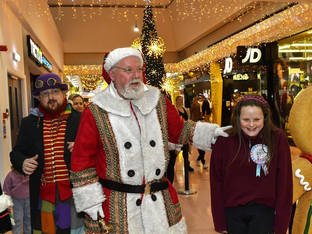 Santa arrives at the Richmond Shopping Centre on Sunday afternoon. Photo: George Sweeney