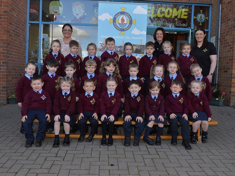 Teacher Mrs Dunne (left) with P1 pupils and classroom assistants at St Eithne’s Primary School.