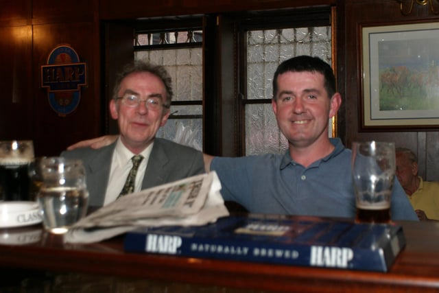 Enjoying a pint over a paper in Tinney's in June 2004.