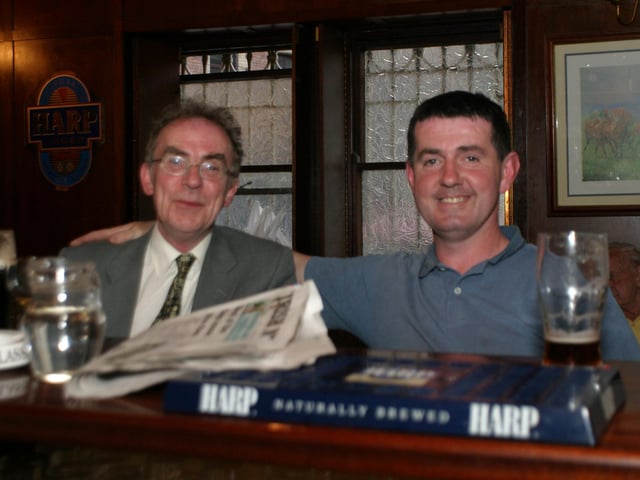 Enjoying a pint over a paper in Tinney's in June 2004.