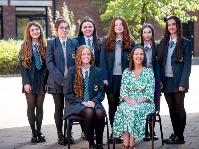 Top Performing Students at GCSE. Front Row: Sarah Hunter, Mrs F. Kearney (Head of Middle School). Back Row: Holly Hutcheon, Alannah Kelly, Megan Kelly, Erin McBride, Eva McConnell, Anna McDaid.