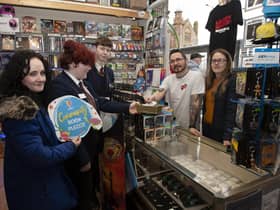 Pete from the Angry Cherry, Foyle Street, Derry pictured making a donation to the Oakgrove College Book Pledge on Friday.