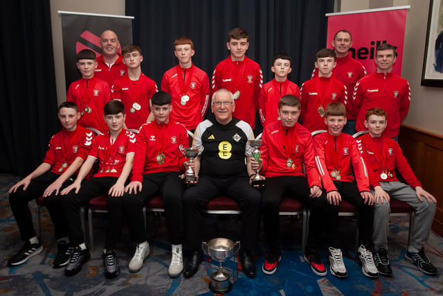 Joe Doherty, IFA Senior Coach, presenting the U-13 Summer Cup, Winter Cup and League Trophy to Tristar FC at the Annual Awards in the City Hotel on Friday night last. Included are coaches Sean Curran and Vinny Morrison.