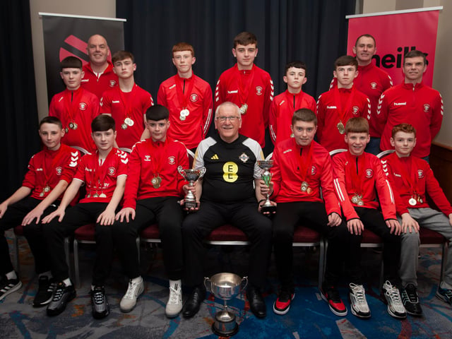 Joe Doherty, IFA Senior Coach, presenting the U-13 Summer Cup, Winter Cup and League Trophy to Tristar FC at the Annual Awards in the City Hotel on Friday night last. Included are coaches Sean Curran and Vinny Morrison.