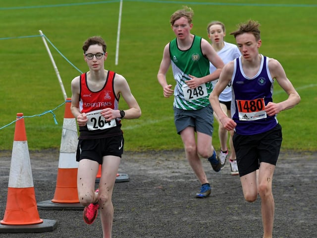 Spartans’ Andre Jamison (264) and Foyle Valley’s Leo O’Carolan (1480) competing in the U15/U17 3k race at Thornhill College. Photo: George Sweeney