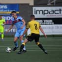 Institute‘s Liam Mullan is challenged by Aston McDermott of Knockbreda.  Photograph: George Sweeney. DER2331GS – 92 