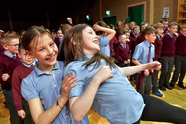 Pupils at St John’s Primary School jive during the Jive Aces performance on Thursday afternoon. Photo: George Sweeney.  DER2317GS – 30